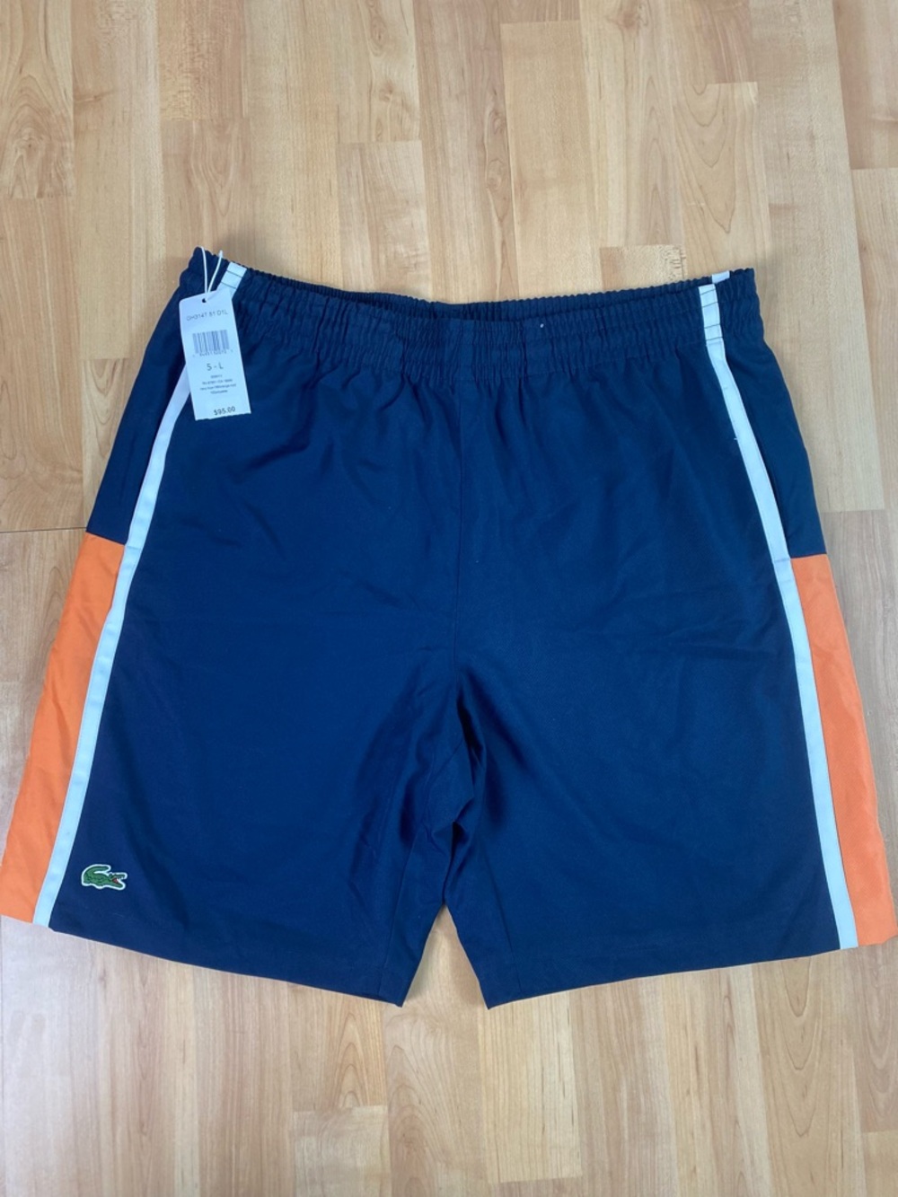 Lacoste Men's Navy Shorts with Orange Side Panels and White Trim